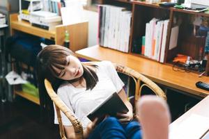 Female asian teenager using tablet for work and study online media technology. photo