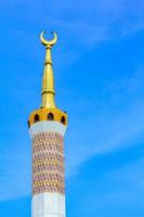 Islamic mosque tower crossing the sky photo