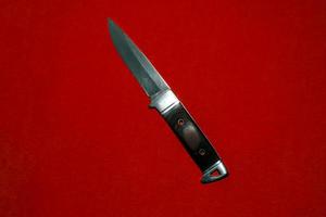 steel knife with brown handle photo