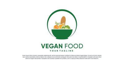 logotipo de comida vegana con vector premium de concepto de árbol y tenedor