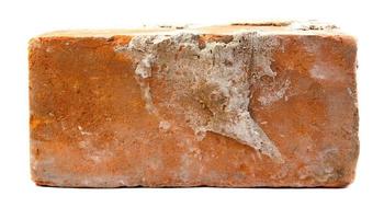 Old red brick isolated on white background photo