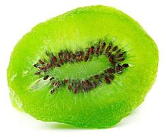 The dried kiwi slice is isolated on a white background. photo