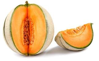 The ripe melon and the piece are isolated on a white background. photo