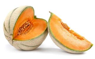 Ripe delicious melon and a piece of melon are isolated on a white background. cantaloupe melon. photo