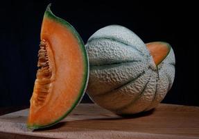 Ripe delicious melon on a wooden board. Beautiful juicy melon. photo