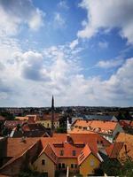 Rows of houses and buildings in Eger, and the beautiful blue sky photo