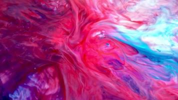 sfondo di inchiostro colorato. astratto colorato vernice inchiostro liquido esplodere diffusione esplosione psichedelica movimento video