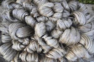 thick brown bundle of raw jute fiber Texture Background photo