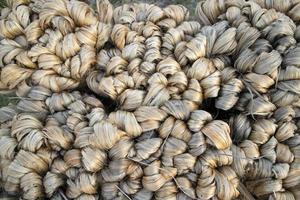 thick brown bundle of raw jute fiber Texture Background photo