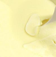 Ice cream with plastic spoon in paper cup photo