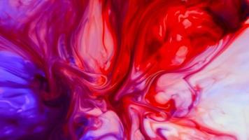 sfondo di inchiostro colorato. astratto colorato vernice inchiostro liquido esplodere diffusione esplosione psichedelica movimento video