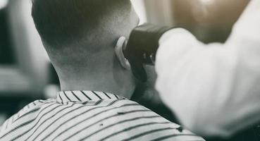 guy sitting in barbershop photo