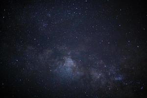 Milky way galaxy with stars and space dust in the universe, Long exposure photograph, with grain. photo