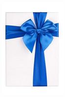 White gift Box with blue ribbon Isolated on white background photo