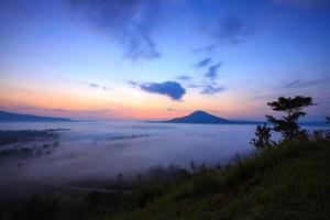 Misty morning sunrise in Khao Takhian Ngo View Point at Khao-kho Phetchabun,Thailand photo