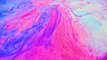 sfondo di inchiostro colorato. astratto colorato vernice inchiostro liquido esplodere diffusione esplosione psichedelica movimento video