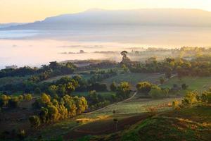 Misty morning sunrise in Khao Takhian Ngo View Point at Khao-kho Phetchabun,Thailand photo