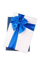 White gift Box with light blue ribbon Isolated on white background photo