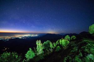 Starry night sky at Monson viewpoint Doi AngKhang and milky way galaxy with stars and space dust in the universe photo