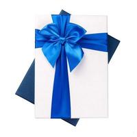 White gift Box with blue ribbon Isolated on white background photo