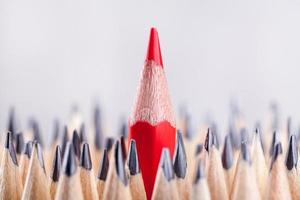 One sharpened red pencil among many ones photo