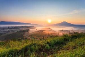 Misty morning sunrise in Khao Takhian Ngo View Point at Khao-kho Phetchabun,Thailand photo