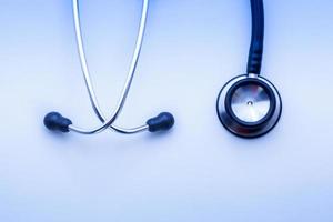 stethoscope on blue background photo