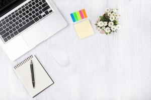 Top view laptop or notebook workspace office on white table photo