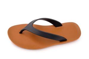 Brown rubber flip flops on a white background photo