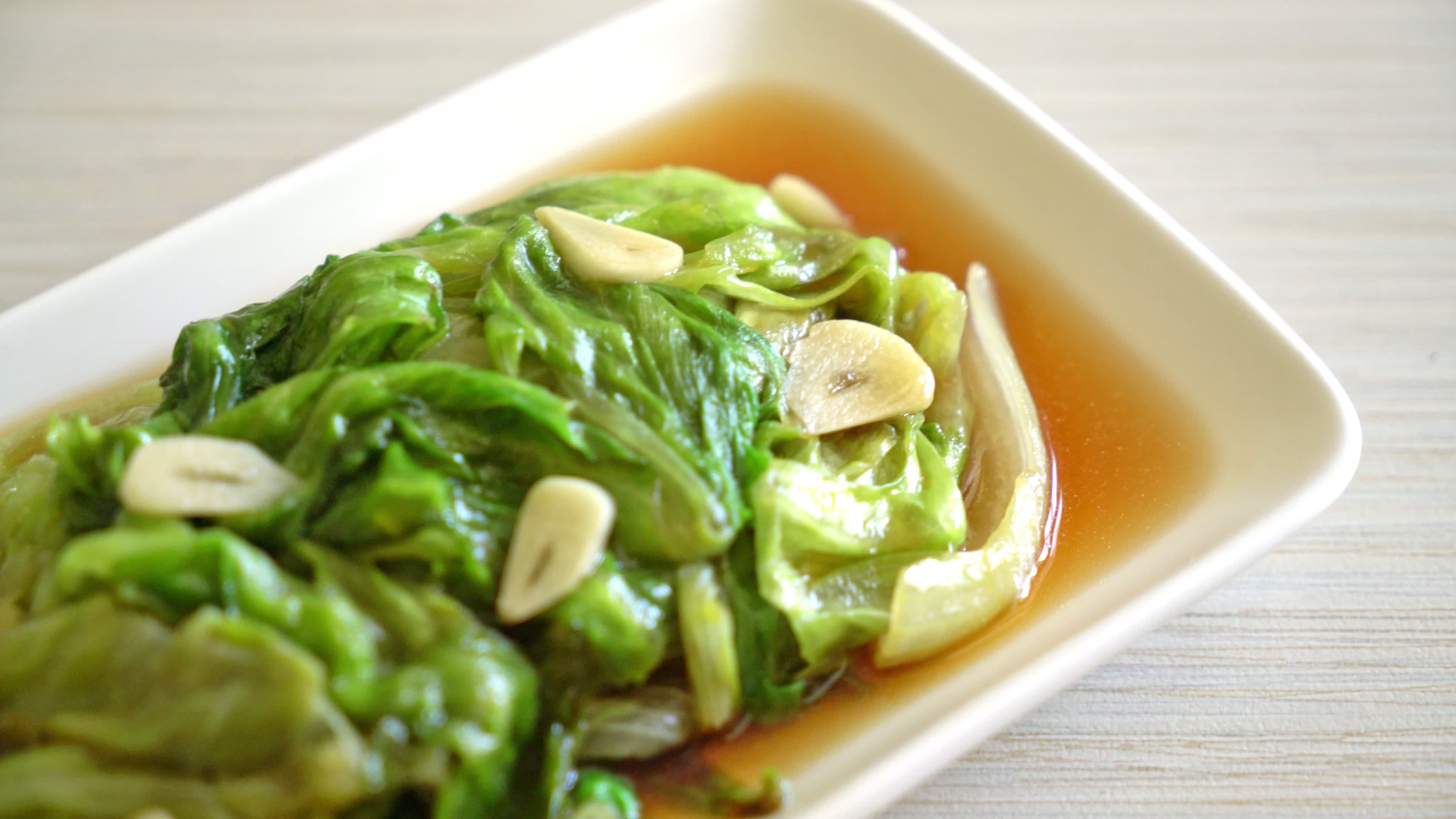 Stir fried Iceberg lettuce with Oyster sauce Healthy food style 9807744 Stock Video at Vecteezy