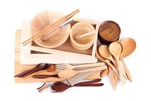 Wooden kitchen utensils on white background photo