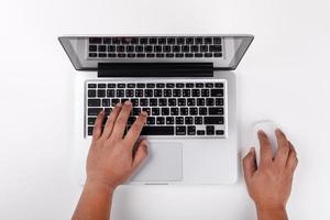 Top view of Businessman working at office desk. Computer, laptop photo