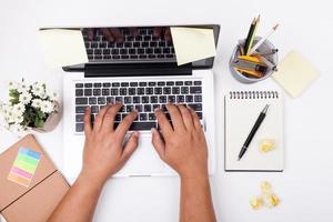 Top view of Businessman working at office desk. Computer, laptop photo