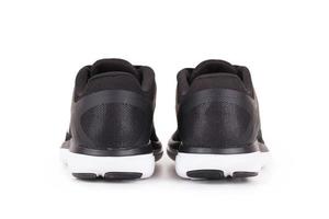 Black sport shoes isolated on white background photo