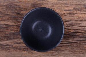 Empty bowl on wood photo