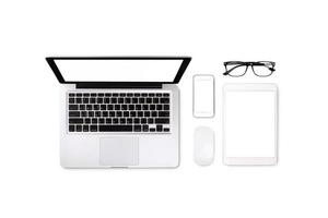 Laptop tablet smartphone and eyeglass on white background with text space and copy space photo