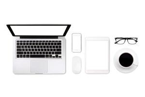 Laptop tablet smartphone eyeglass and coffee on white background with text space and copy space photo