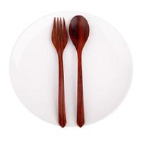 Wood spoon, fork and plate isolated on white background