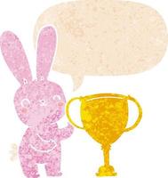 lindo conejo de dibujos animados con copa de trofeo deportivo y burbuja de habla en estilo retro texturizado vector
