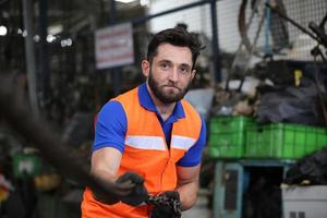 Industrial Engineers in Hard Hats.Work at the Heavy Industry Manufacturing Factory. industrial worker indoors in factory. man working in an industrial photo