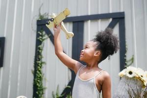 Child Play With Airplane outdoor - Imagination And Freedom Concept photo