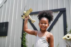 Child Play With Airplane outdoor - Imagination And Freedom Concept photo