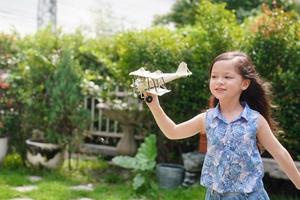 Child Play With Airplane outdoor - Imagination And Freedom Concept photo