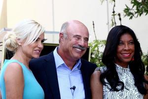 LOS ANGELES, MAY 31 - Yolanda Foster, Dr Phil McGraw, Natalie Cole at the David Foster Hollywood Walk of Fame Star Ceremony at the Capital Records Building on May 31, 2013 in Los Angeles, CA photo