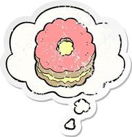 cartoon biscuit and thought bubble as a distressed worn sticker vector