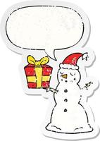 cartoon snowman and present and speech bubble distressed sticker vector