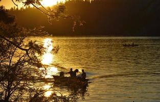 Kids in Boat at Sunset photo