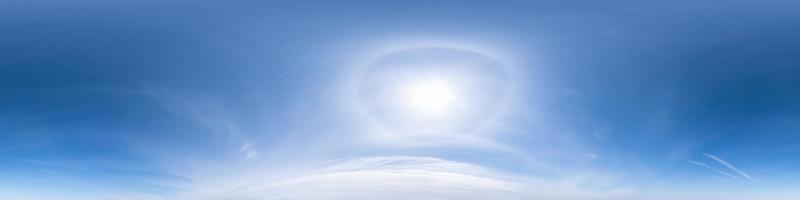 clear blue sky with halo sun. Seamless hdri panorama 360 degrees angle view with zenith for use in 3d graphics or game development as sky dome or edit drone shot photo