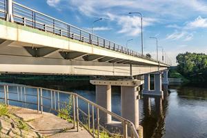 car bridge across the wide river photo