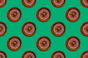 Seamless pattern of game table roulette from elite casino on green background photo